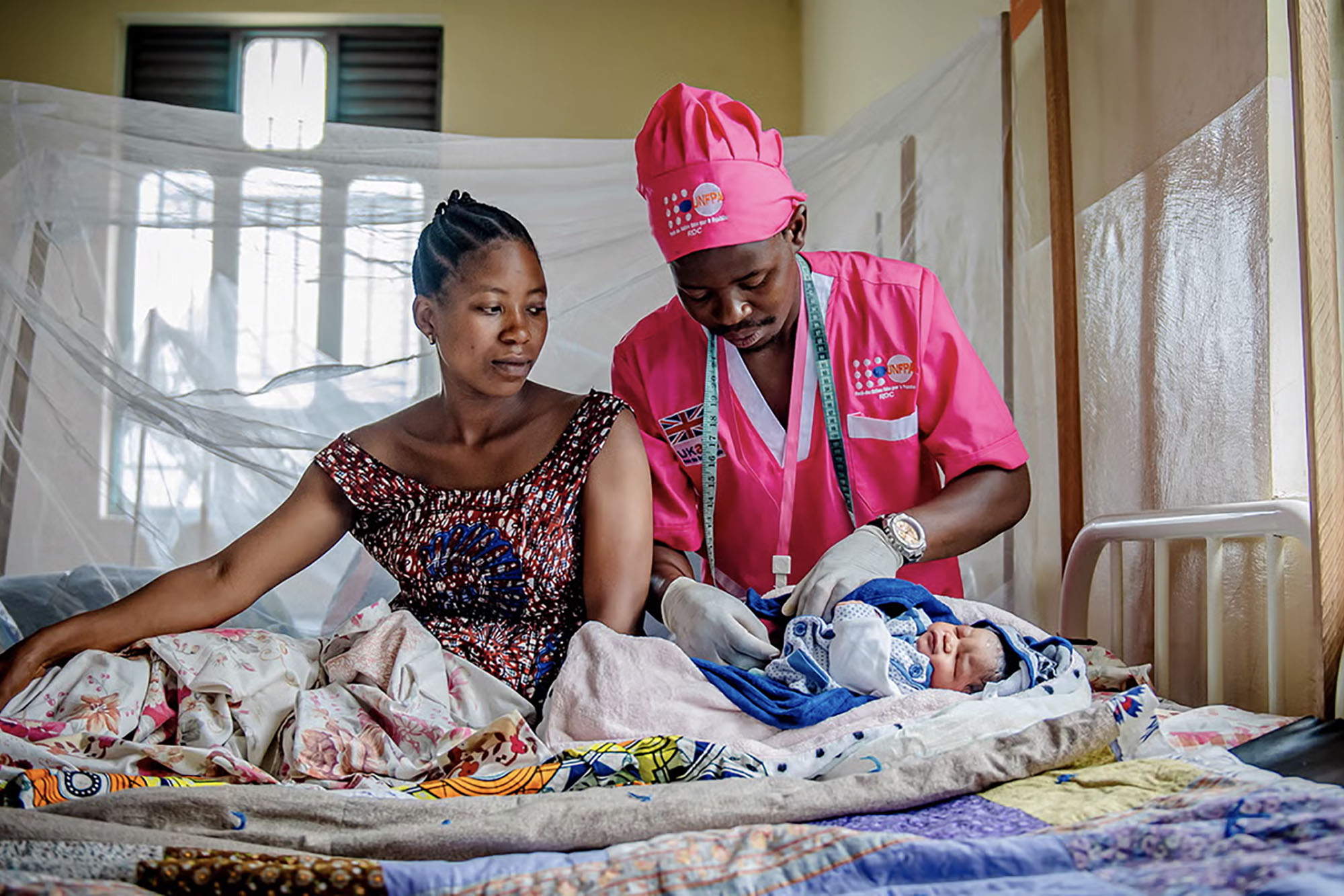 A midwife attending to a woman in the Democratic Republic of Congo.