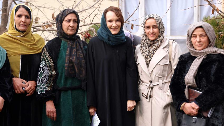group photo of Georgette standing amid women and all are wearing the veil