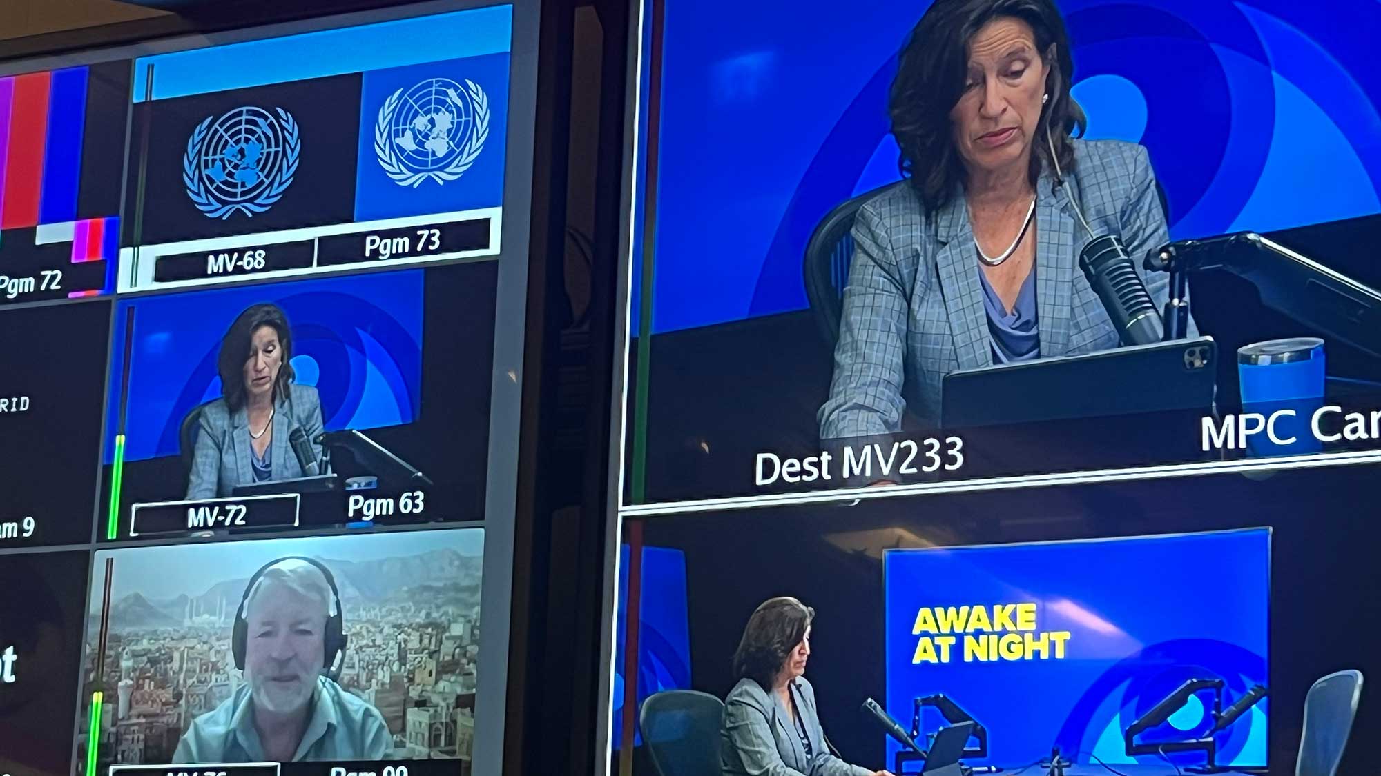 Melissa recording in the studio with Peter on a large screen