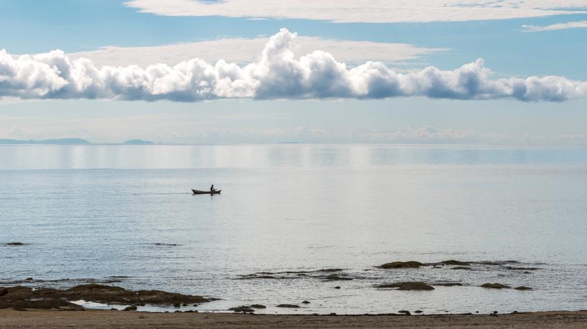 Fishing boat at sunrise on Lake Malawi in Africa. Adobe Stock/Beautyness