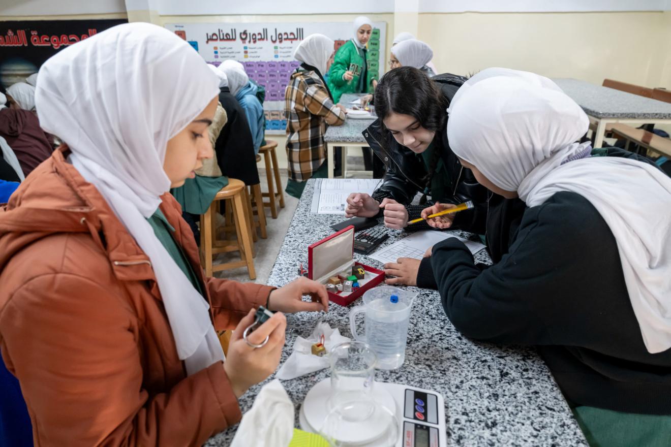Students in a science class at a UNRWA school for girls in the Wihdat Camp for Palestine refugees in Amman, Jordan.