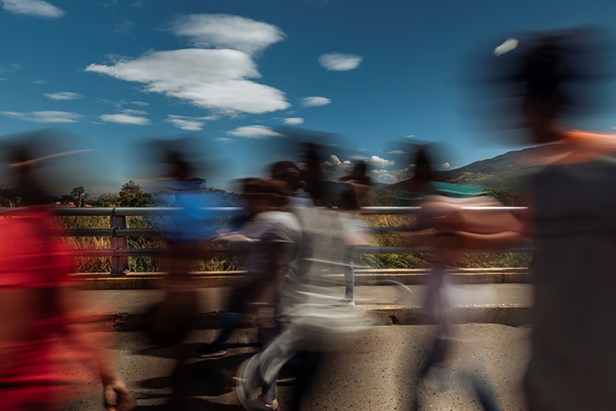 A dynamic view featuring people in motion with blurred figures.