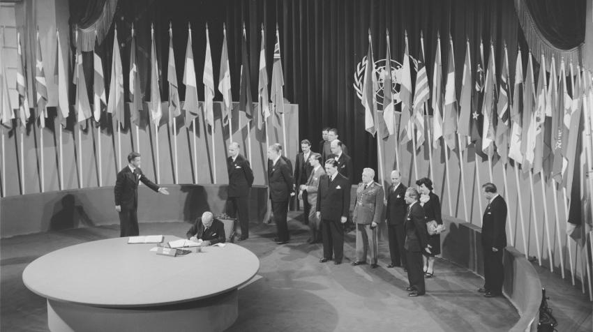 Pedro Leao Velloso, Minister of State for Foreign Relations, Chairman of the Delegation from Brazil, signing the Charter of the United Nations at the Veterans' War Memorial Building, San Francisco, United Sates, 26 June 1945. UN Photo/McLain