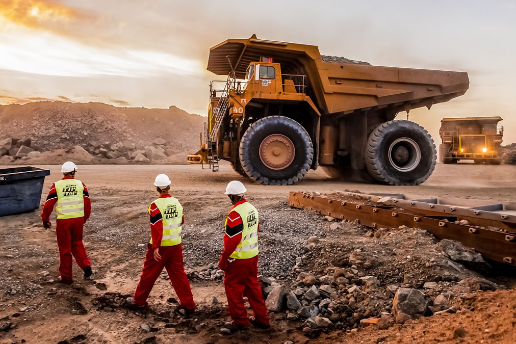 Mining vehicles at a site.